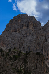 The landscape and the peaks of the Dolomites of the Val di Fassa, one of the most famous and touristic valleys of Trentino, near the town of Canazei, Italy - August 2022.