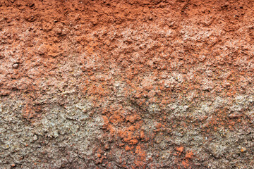Red gray embossed cement background old wall