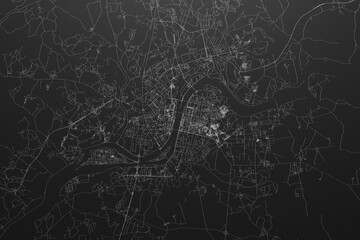 Street map of Pyongyang (North Korea) on black paper with light coming from top