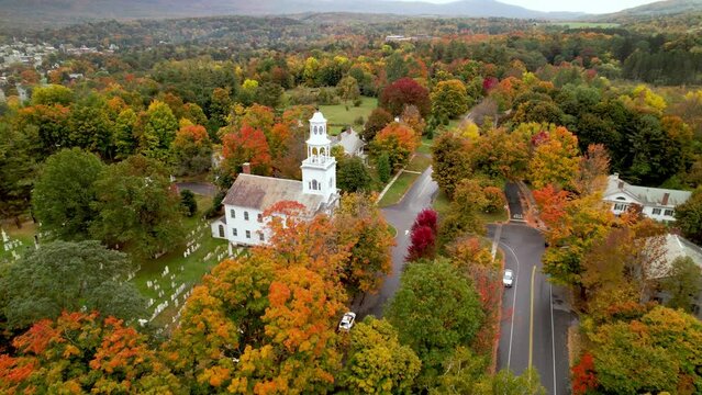 aerial push in to church in fall foilage in bennington Vermont in 4k