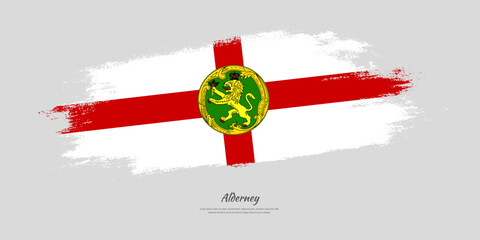 Happy National Day of Alderney. National flag on artistic stain brush stroke background.