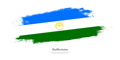 Happy Republic Day of Bashkortostan. National flag on artistic stain brush stroke background.