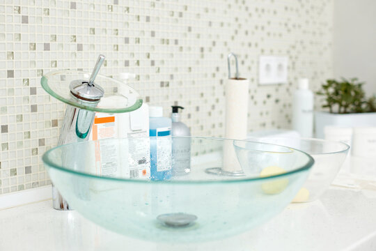 Glass Sink On White Countertop In Bathroom