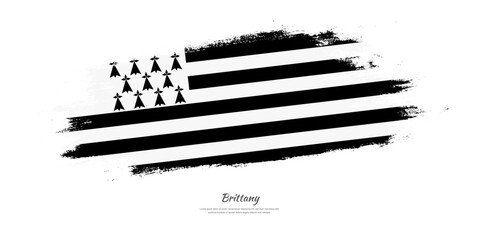 Happy National Day of Brittany. National flag on artistic stain brush stroke background.