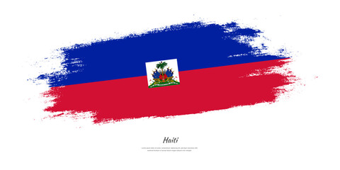 Happy Independence Day of Haiti. National flag on artistic stain brush stroke background.