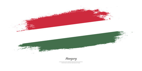 Happy National Day of Hungary. National flag on artistic stain brush stroke background.