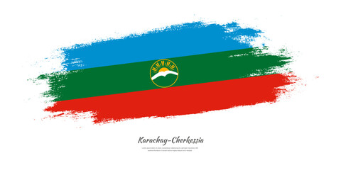 Happy National Day of Karachay-Cherkessia. National flag on artistic stain brush stroke background.