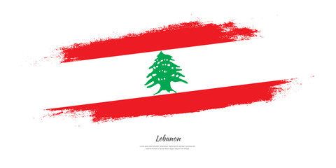 Happy Independence Day of Lebanon. National flag on artistic stain brush stroke background.