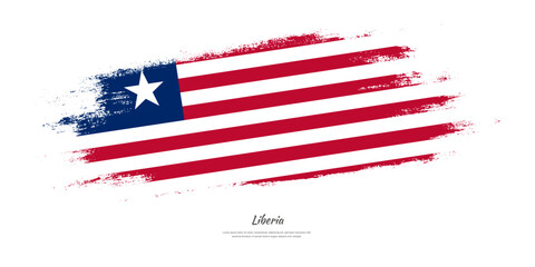 Happy Independence Day of Liberia. National flag on artistic stain brush stroke background.
