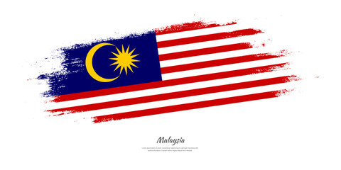 Happy Independence Day of Malaysia. National flag on artistic stain brush stroke background.