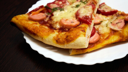 Hot homemade pizza on a plate ready to eat. Selective Focus
