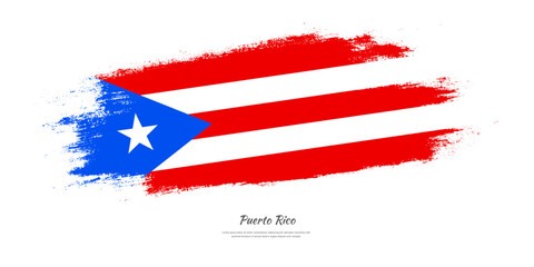 Happy Independence Day of Puerto Rico. National flag on artistic stain brush stroke background.