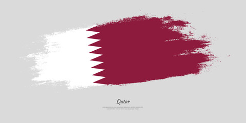 Happy Independence Day of Qatar. National flag on artistic stain brush stroke background.