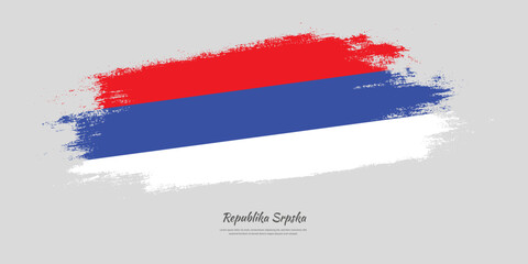 Happy Republic Day of Republika Srpska. National flag on artistic stain brush stroke background.