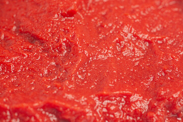 Tomato paste texture background close-up.