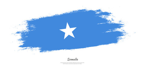 Happy Independence Day of Somalia. National flag on artistic stain brush stroke background.