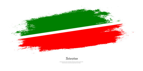 Happy Independence Day of Tatarstan. National flag on artistic stain brush stroke background.