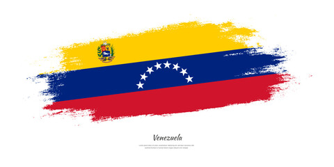 Happy Independence Day of Venezuela. National flag on artistic stain brush stroke background.