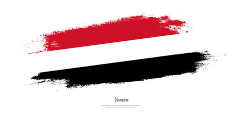 Happy Independence Day of Yemen. National flag on artistic stain brush stroke background.