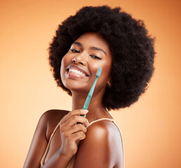 Black woman and portrait with toothbrush for dental wellness and teeth whitening in orange studio background. Afro, healthy and happy lady with oral hygiene, mouth cleaning or white smile face mockup