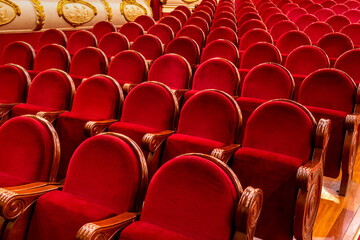 Red velvet seats in a theater in Villena, Spain.