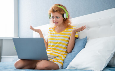 shocked woman freelancer in headphones. freelancer woman at home. freelancer woman work with laptop