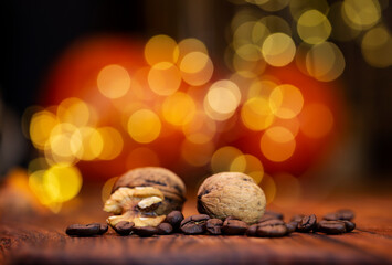 Roasted coffee beans with walnuts flavor on bokeh shiny golden background