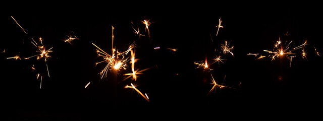 Set of festive sparkler with sparks on black background for overlay blending mode for holiday...