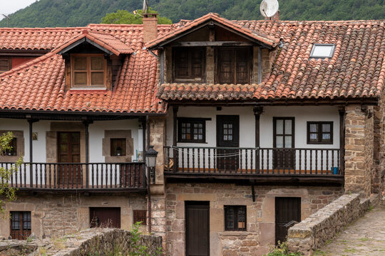 Beautiful town of Barcena Mayor with the traditional stone houses of the mountains of Cantabria on a sunny day. Cantabria, Spain.