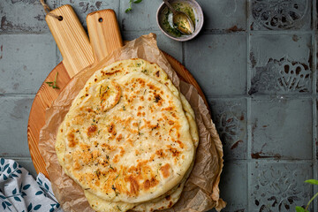 Indian bread Naan with cheese and garlic - obrazy, fototapety, plakaty