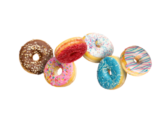 Confectionery as sweets and doughnuts collage isolated on white background. Colourful donuts flying over white with clipping path. Full Depth of field.