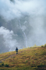 Hiker with children on footpath  in the fog. Norway on footpath  in the fog. Norway