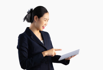 Asian businesswoman in black jacket using tablet computer touching watching and chatting white backgrond.

