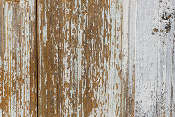 old board with peeling paint. Background and texture, wooden surface