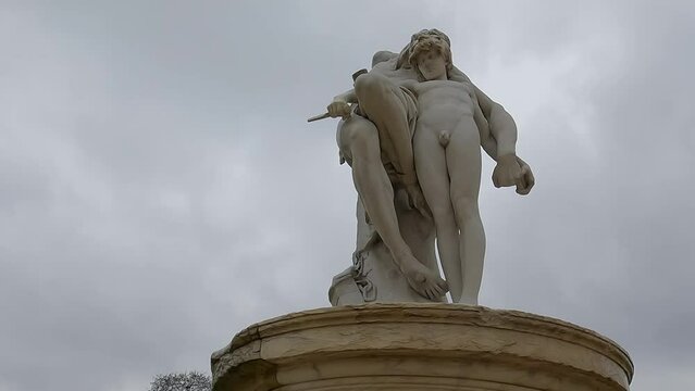 Paris, France. 03-31-2022. Beautiful statue in Garden Tuileries. Historic sculpture. City of Paris. Panning 4K