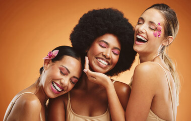 Beauty, skincare and model women in studio with flowers, makeup and cosmetics by brown background. Diversity, happiness and friends with natural self care, cosmetology and face treatment with floral.