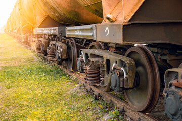 Fototapeta na wymiar Railroad train of tanker cars transporting crude oil on the tracks