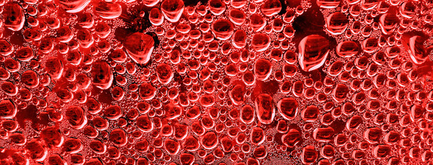 Condensation red water. Real background with  texture drops on glass