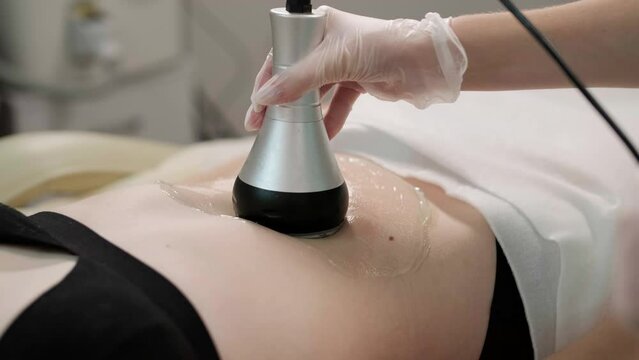 Body RF lifting procedure. Woman getting anti-cellulite and anti-fat therapy