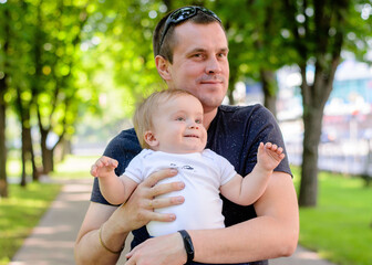 Father and son in the park. Close-up. Happy fatherhood, summer park. Father's Day concept