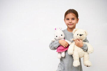 Portrait of little girl with white toy bear