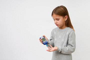 Girl checking diabetes test, white background