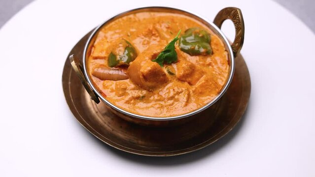 Kadai Paneer is a spicy, flavourful and delicious gravy dish made with  paneer, bell pepper, and onion in a freshly ground spice and served with  lachcha parantha and onion 