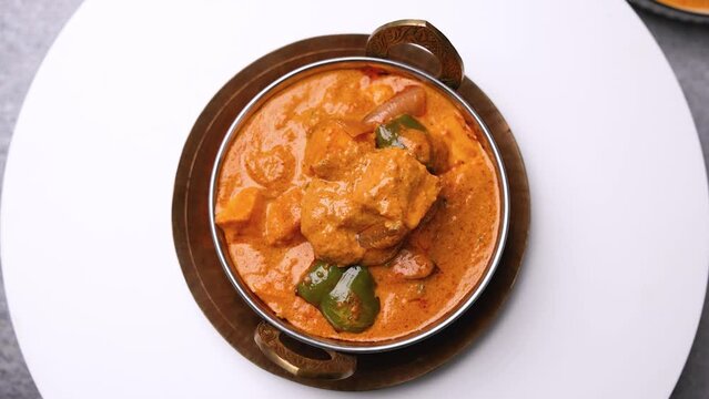 Kadai Paneer is a spicy, flavourful and delicious gravy dish made with  paneer, bell pepper, and onion in a freshly ground spice and served with  lachcha parantha and onion 