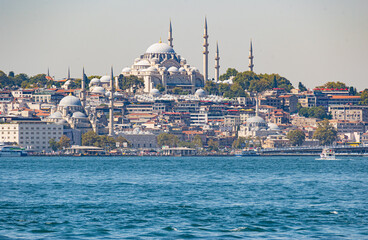 Fototapeta na wymiar Big cargo ships crossing the Bosphorous through Istanbul with Agia Sofia in the background