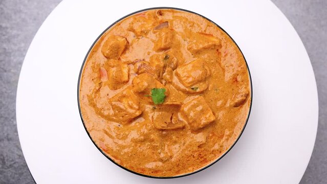 Kadai Paneer is a spicy, flavourful and delicious gravy dish made with  paneer, bell pepper, and onion in a freshly ground spice and served with  lachcha parantha and onion 