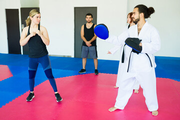 Attractive woman with a personal defense coach