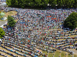 Muslim worshipers praying. Large crowd of Muslim people praying namaz. Muslims praying. Bosnians commemorate 24th anniversary of Srebrenica genocide. Religion.