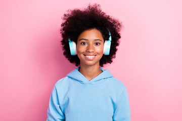 Photo portrait of adorable small girl headphones listening music playlist smile wear trendy blue...