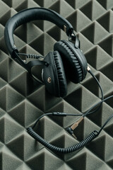 Fototapeta na wymiar headphones lie on acoustic foam rubber